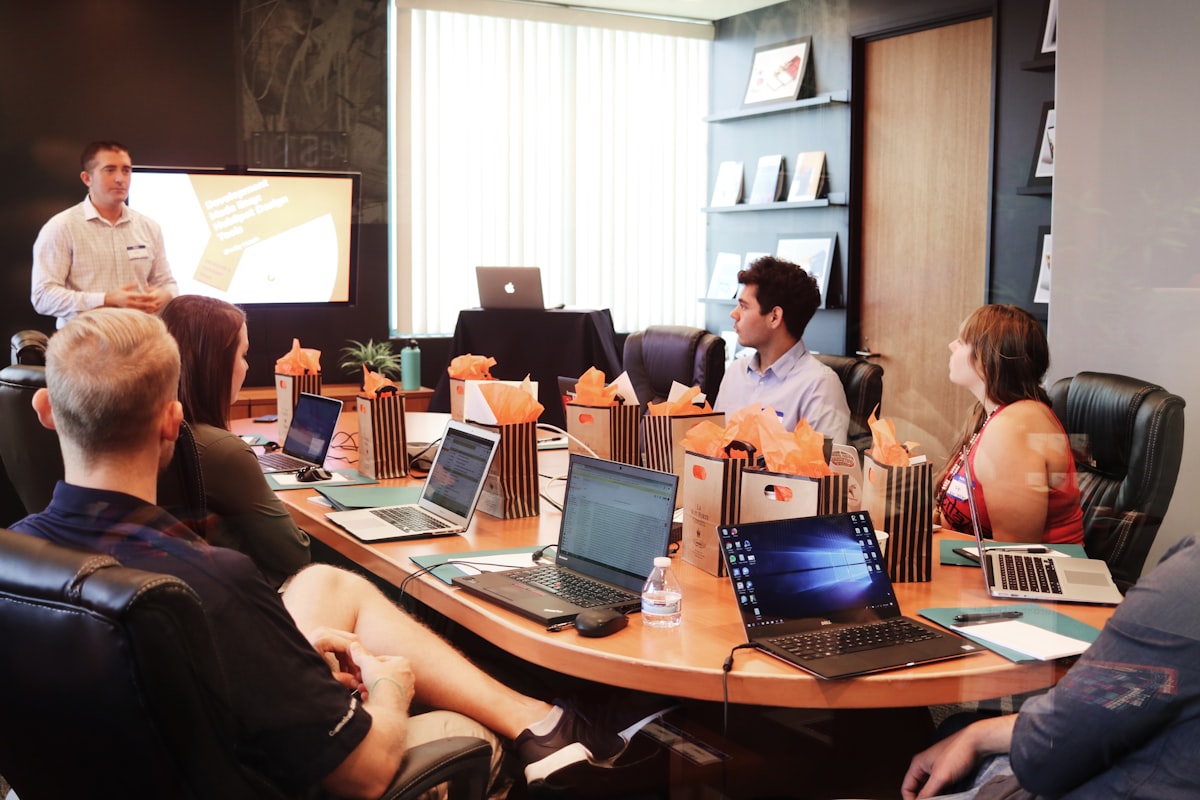 Operations team collaborating around a shared workspace